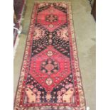 A modern Persian Qashqai corridor rug, 310 x 110cm.
