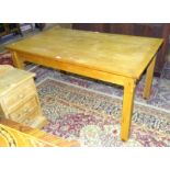 A light oak rectangular-top dining table on square legs, 144.5 x 84cm, 74cm high, by Ron Jones,