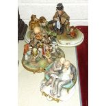 A Capodimonte sculpture of a seated tramp playing an accordion, with a monkey holding a hat and a