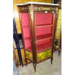 An ormolu-mounted concave-sided display cabinet with marble top, 93cm wide x 160cm high and a low