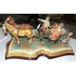 A Capodimonte sculpture of a carriage drawn by two horses, with driver, courting couple and a