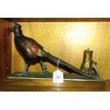 An early-20th century Austrian cold-painted spelter table lighter in the form of a pheasant, on