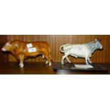A John Beswick figure 'Limousin Bull', together with a The China Cave 'Chillingham Wild Bull' on
