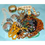 A quantity of costume jewellery, including filigree buttons and amber-chip necklaces.