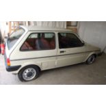 An Austin Mini Metro 1.3L HLS 3-door hatchback motor car, registration number POD 435W, sand colour,