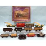 Hornby O gauge, six unboxed pre-war wagons and eight other tinplate wagons, in Hornby train set box,