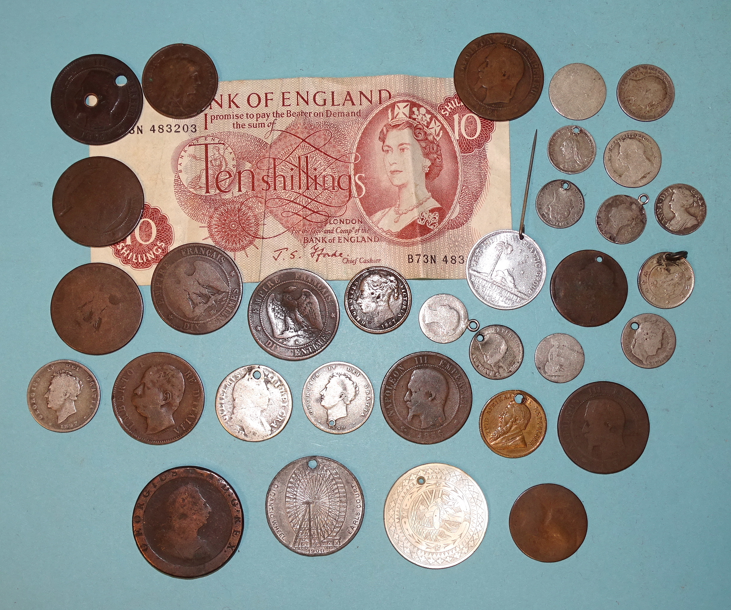 A George IV 1827 shilling, an 1829 shilling, (holed), other silver coins, (a/f), a 1797 cartwheel