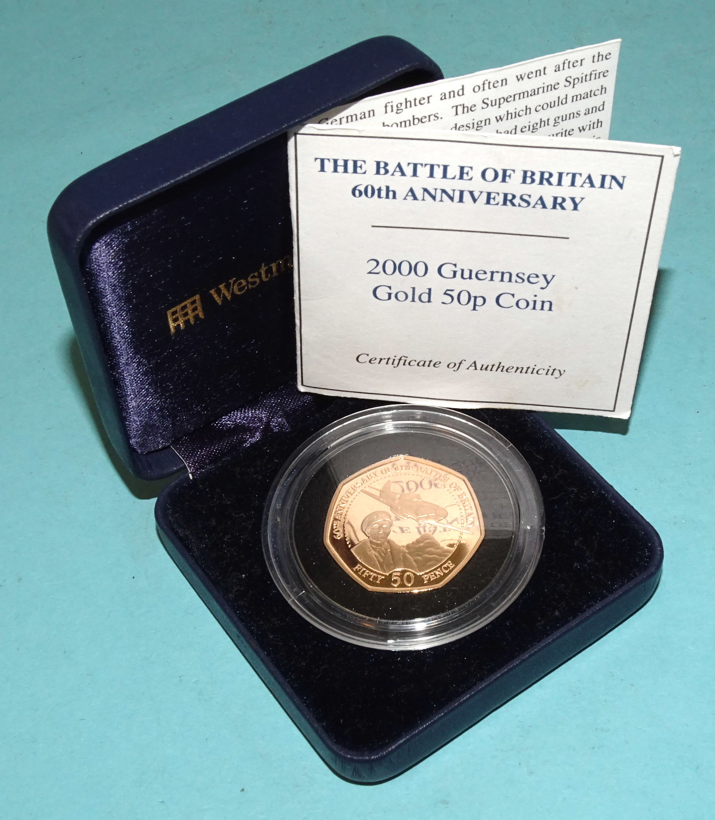 A Royal Mint 2000 Guernsey gold 50p coin 'The Battle of Britain 60th Anniversary', 15.5g, (cased,