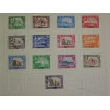 A collection of stamps in four albums and loose, with mint British Empire and Great Britain, with