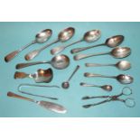 A pair of silver sugar nips, a pair of silver sugar tongs, various silver spoons and a plated