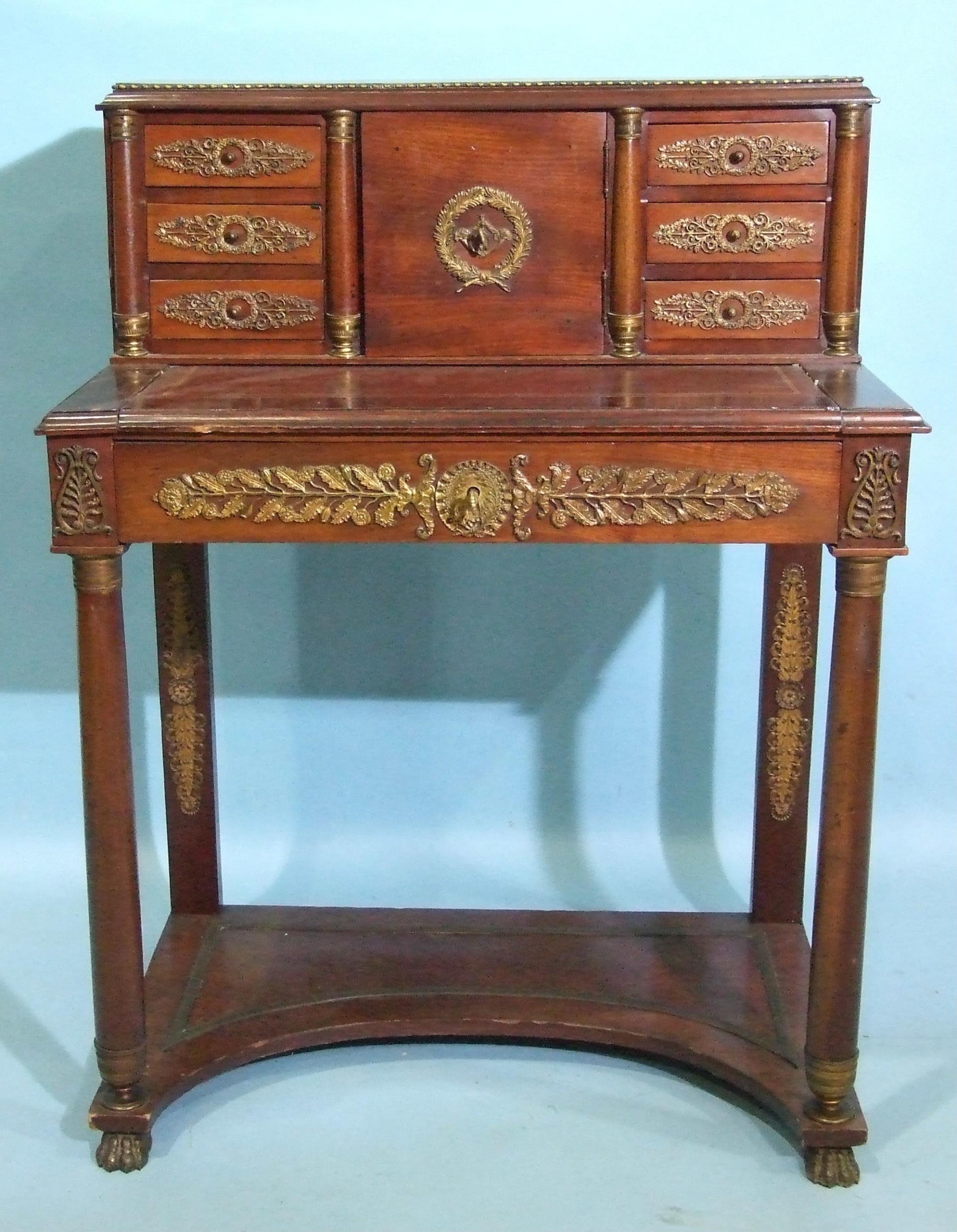 A late-19th century French Empire-style ormolu-mounted ladies' writing desk, the upper part fitted