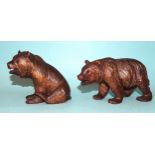 A Black Forest carved wood model of a walking bear, 15 x 8cm high and another of a seated bear, 9.