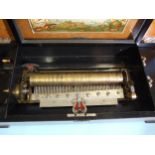 A 19th century Swiss rosewood musical box playing twelve airs, the comb with four teeth missing,