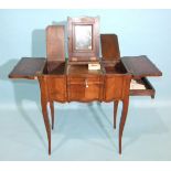 A late-19th century Continental ladies' dressing table of serpentine outline, the top with fold-