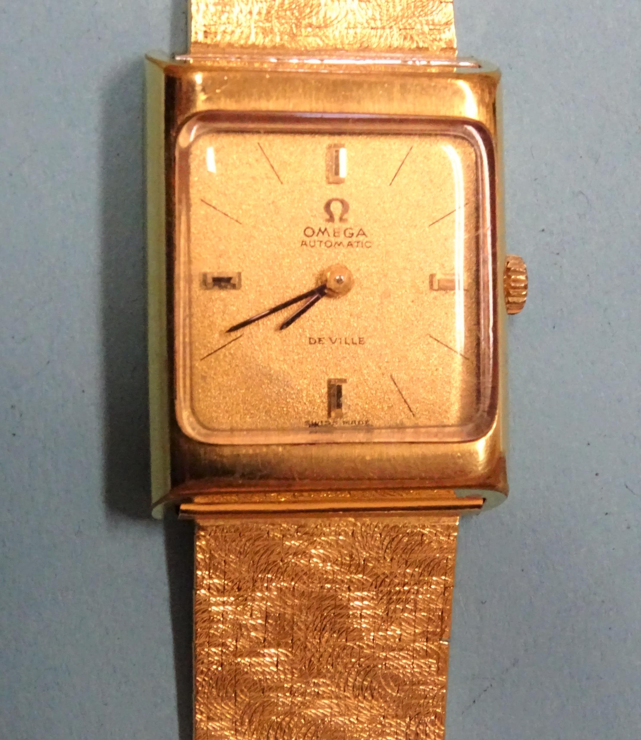 Omega, De Ville Automatic, a ladies' gold-plated wrist watch, the gilt face with baton numerals, the