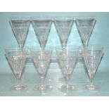 A set of eight conical-shaped wine glasses on plain circular feet, (chip to one foot), 14.5cm