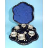 A Victorian cased set of six silver salts, each of circular form with embossed decoration, on