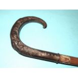 A late-20th century Victorian-style silver-handled walking stick by Broadway & Co, the handle