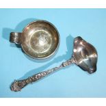 A Continental silver ladle with cast handle and double-spout bowl, stamped .930 and a metal wine