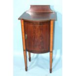 An inlaid and satinwood-banded Edwardian bow-fronted bedside cabinet, on square tapered legs with