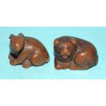 A carved wood netsuke of a hare, signed beneath, 3 x 4cm and another of a feline animal, (2).