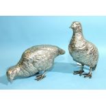 A pair of silver-plated partridge table ornaments, unmarked, the taller 17cm high, (2).