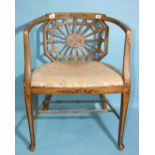 A 19th century painted wood armchair with pierced back and caned seat, on chamfered legs with turned