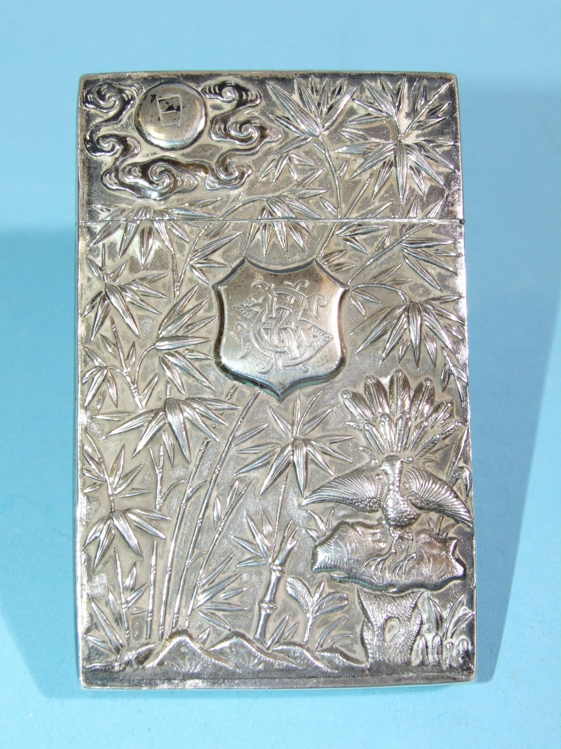 A Chinese silver card case decorated with bamboo and birds, 10 x 6.3cm, marked Wang Hing.