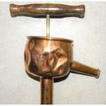 A Royal Naval rum/spirit pump, copper with wooden pump handle and brass perforated foot, 105cm