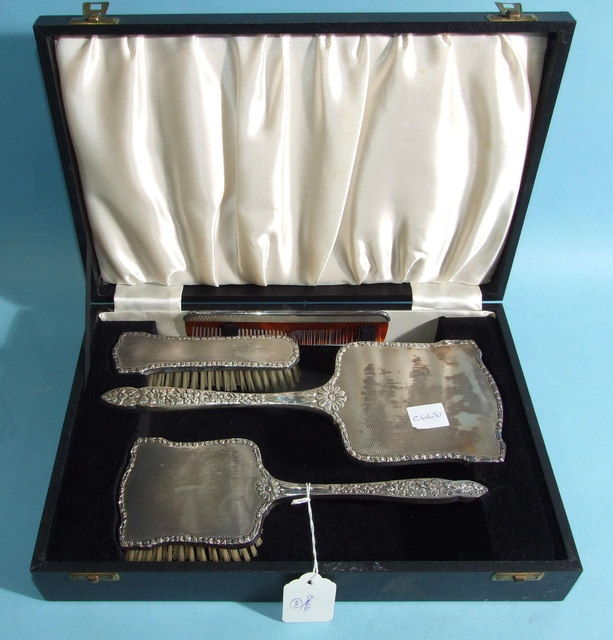 A cased silver-mounted four-piece dressing table set, having embossed floral and engine-turned - Image 2 of 2