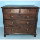 An antique oak chest of two short and three long drawers, on bracket feet, with later softwood