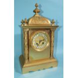 A 19th century gilt metal mantel clock of architectural form, the domed case with decorative