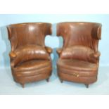 A pair of early-20th century leather-upholstered hall porter or waiting room chairs of oval shape