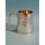 An Edwardian silver christening mug with engraved leaf decoration, 8.5cm high, London 1909,