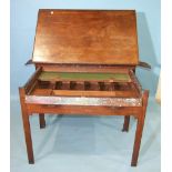 A Georgian mahogany architect's table of typical form, with hinged top, fitted interior and pull-out