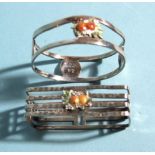 A sterling silver rectangular napkin ring with applied enamel orange fruit, 5 x 2.3cm and a