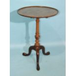 A mahogany tripod tilt-top circular table on carved column, 50cm.