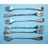 A set of six sterling silver long-handled seafood forks, the handles embossed with fish, marked