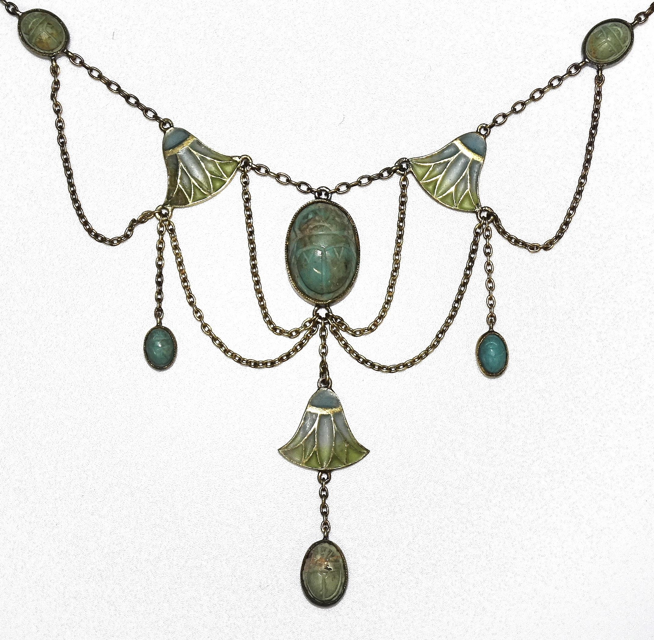 An early-20th century Egyptian Revival silver-gilt plique-à-jour necklace millegrain-set six blue