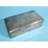 A rectangular silver-covered cigarette box, 16.5 x 9cm, 4.5cm high, Birmingham 1958, (dents to