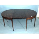 A Georgian mahogany D-end dining table, 123cm diameter extending to 176cm, with one spare leaf.