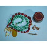 A necklace of graduated malachite beads, 58cm long, an agate pendant on glass and chain necklace,