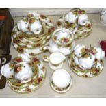 Fifty-eight pieces of Royal Albert 'Old Country Roses' tea ware, together with linen napkins,