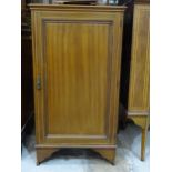 An Edwardian cross-banded mahogany single door cupboard, 64cm wide, 119cm high, 61cm deep and a