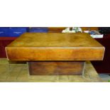 A low leather-covered occasional table, 51 x 70cm.