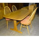 An Ercol dining table on refectory-style legs, 88 x 153cm and four hoop stick-back chairs.