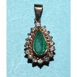 An emerald and diamond pendant collet-set a pendeloque-cut emerald within a surround of sixteen 8/