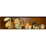A collection of Royal Doulton character jugs, comprising 'Aramis' (large), 'Merlin' (large), 'Fat