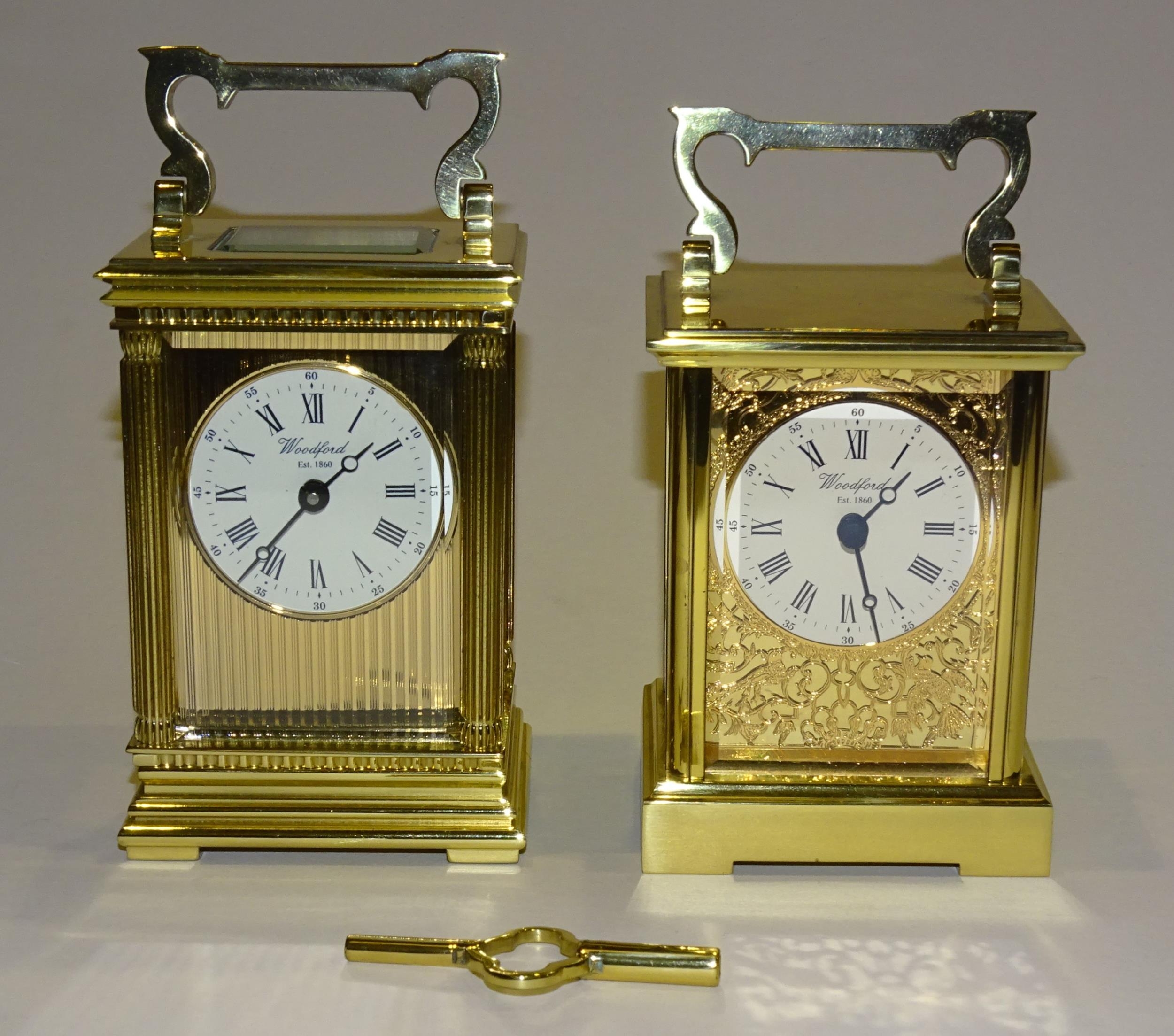 Woodford, a modern brass-cased English carriage clock, the circular dial set with Roman numerals,