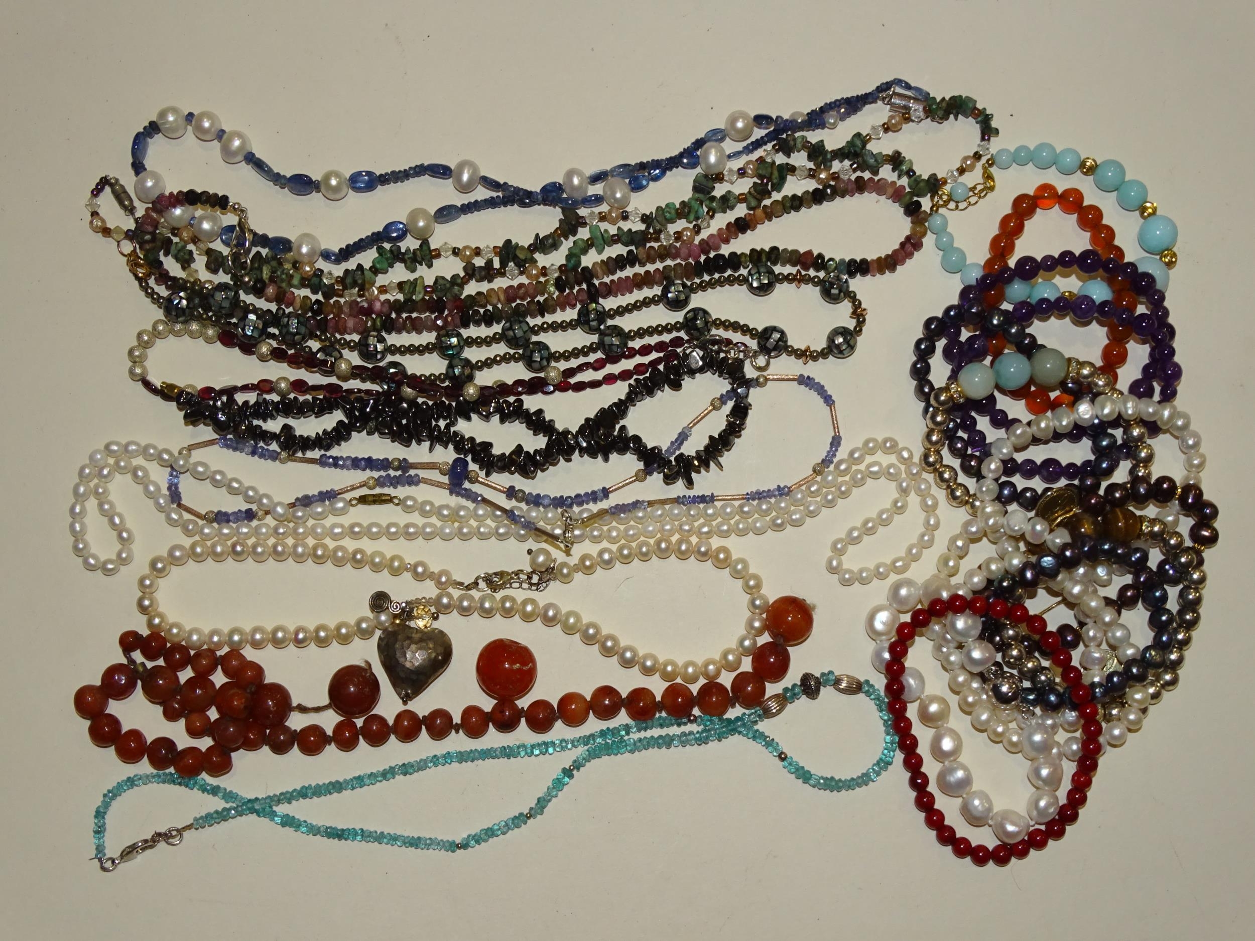 A Tanzanite bead necklace and a quantity of freshwater pearl and gemstone necklaces and bracelets.
